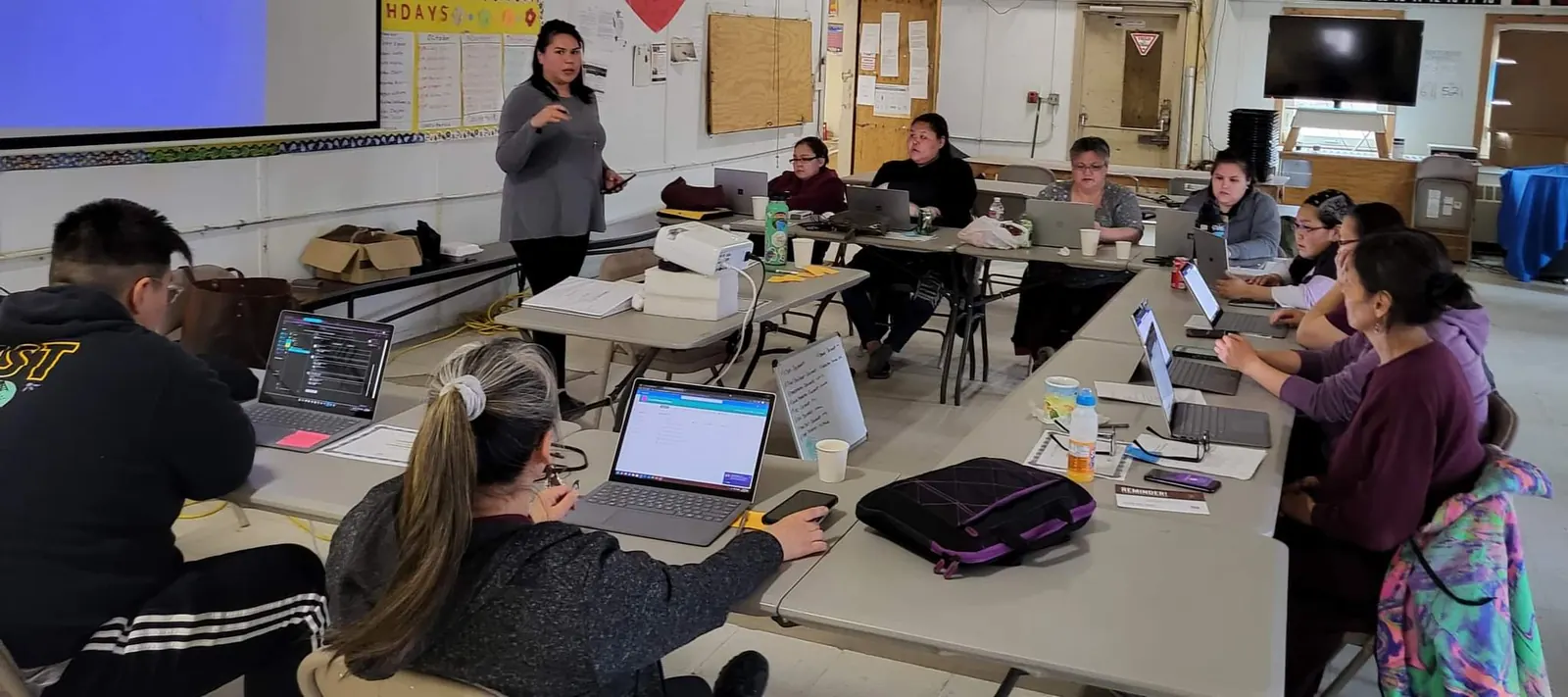 Training room with participants using laptops